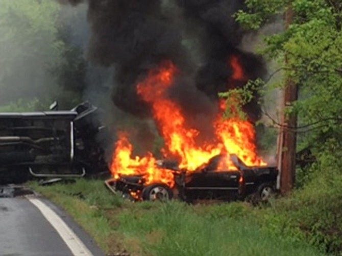 A car crash near the intersection of River Road and Seneca Road left a car engulfed in flames.
