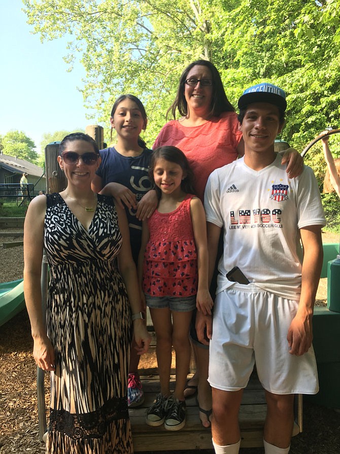 St. Aidan's Day School in Fort Hunt celebrated its 50th birthday with a party on Sunday, April 30, in Fort Hunt. From left are Emilie Yoder, who attended St. Aidan's Day School and is now a day school parent, with her niece Gabriela Espinola, 10; sister Amanda Espinola; nephew Javier Espinola, 15; and niece Giuliana Espinola, 7. Amanda Espinola attended the day school, sent all four of her children to the school, and works as an assistant teacher.
