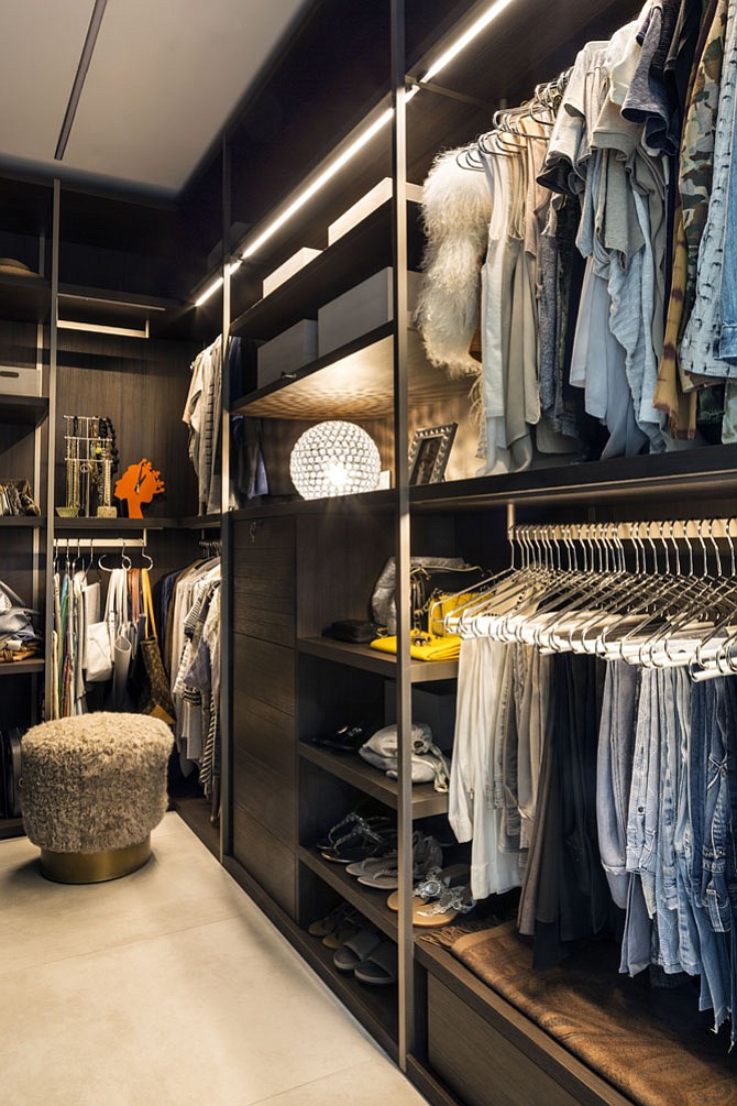 Open shelving for storing shoes and handbags are among the features that designer Julia Walter recommends for walk-in closets. 