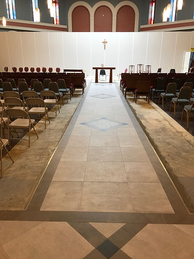 St. Veronica’s center aisle tile work has been installed.
