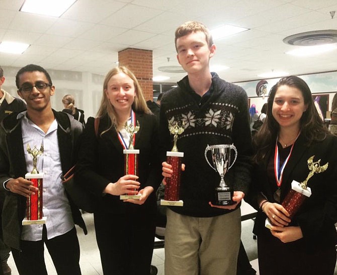 T.C. Williams High School Varsity Debate team co-captains Jay Falk, right, and Victoria Peace, second from left, will be featured in the May 22 Agenda:Alexandria discussion on gun control.