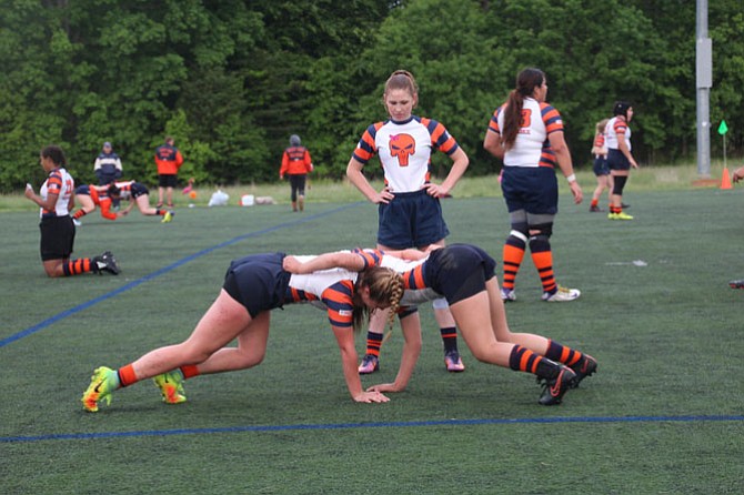 The West End girls rugby team does a little warming up during Virginia Senior Night.