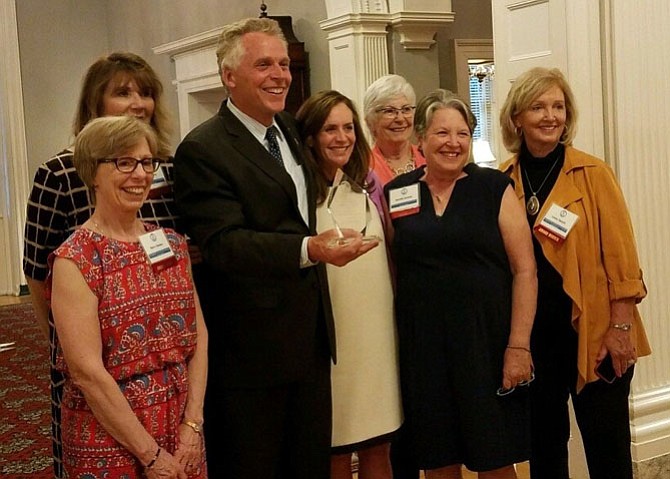 From left: Marcy Stennes, Cheryl Laferty, Gov. Terry McAuliffe, Dorothy McAuliffe, Cindy Notham, Dorothy Keenan and Kay Larmer in Richmond. GrandInvolve received the Governor’s Community Organization Award on April 20, 2017. 