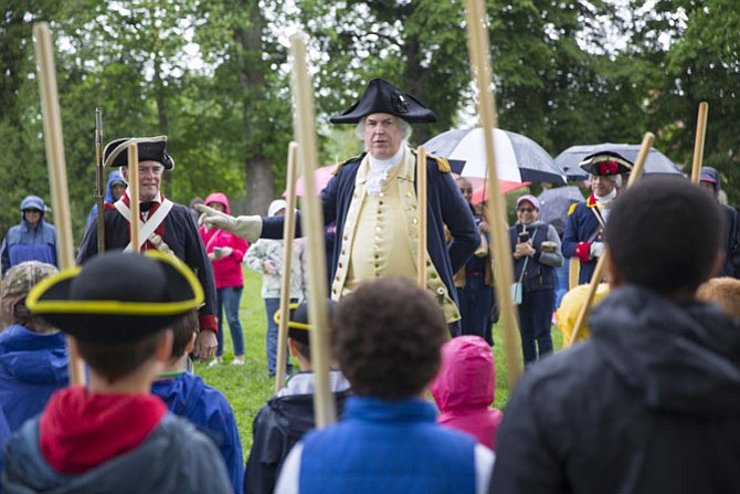 General George Washington inspects Continental Army troops during the Revolutionary War weekend at the Mount Vernon estate May 6 and 7.