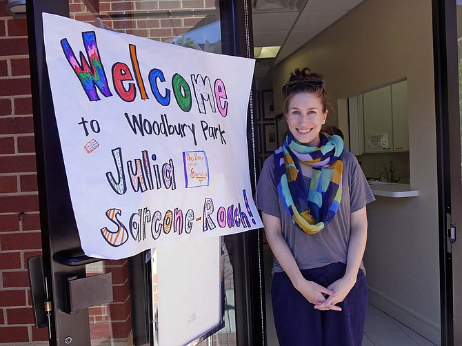 Julia Sarcone-Roach returned to Arlington on May 15 to read her most recent children's book to low-income, mostly immigrant children at Woodbury Park Apartments. 