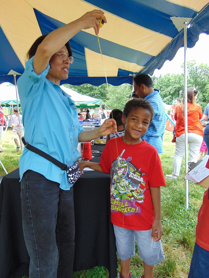 Jordan Butts, 5, of Lorton, gets measured for his Child I.D. by Nydia Guzman during the Hope and Health Festival on Saturday, May 20, 2017, at Lorton Library. The service was offered by the Fairfax County Sheriff's Department. 
