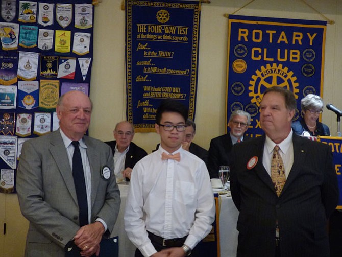 Edison High School senior Vincent Mai, center, is presented a scholarship by the Alexandria Rotary Club May 23 for his achievements in the Advanced Network Administration program. Making the presentation at Belle Haven Country Club are Rotarians Charles Ballou, left, and Jim Carmalt.