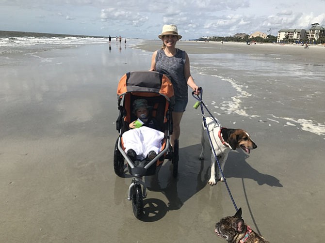 Melody joins her “fospice” family for a walk on the beach.