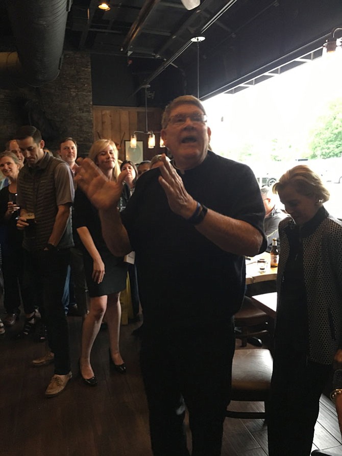 Monsignor John Enzler receives birthday wishes at a fundraiser for Life Connection Mission at Lahinch Tavern and Grill in Potomac on May 24.