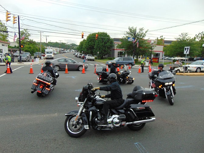 Members of the Fairfax HOG Drill Team from the Fairfax Harley Owners Group perform motorcycle stunts before the Ride of the Patriots procession into the District.
