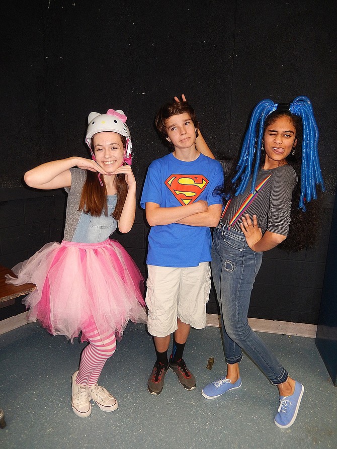 From left: Lily Black, Jared Belsky and Shreya Surapaneni pose in character for Chantilly High’s upcoming children’s play, “Imagine If.”