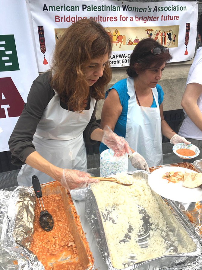 The American Palestinian Women's Association serves the traditional Palestinian iftar dinner to homeless in D.C. outside Catholic Charities in 2016.
