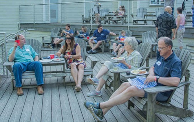 People dine on the deck at the park’s visitors’ center.