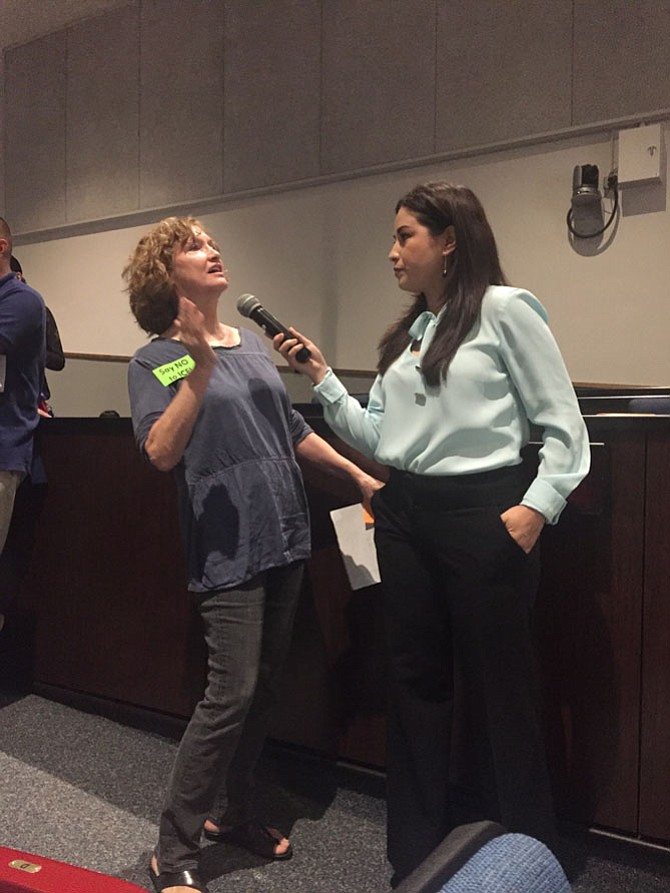 Diane Alejandro (left) expresses her concerns with the Fairfax County police during the open mic part of the forum.