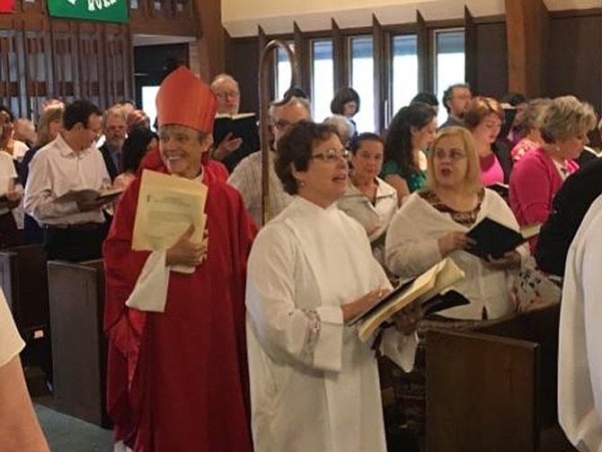 The Rev. Meredith Tobin Heffner (right) at her installation May 20 as the fifth rector of St. James' Episcopal Church, Potomac. The Right Rev. Mariann Edgar Budde (left), bishop of the Episcopal Diocese of Washington presided. 
