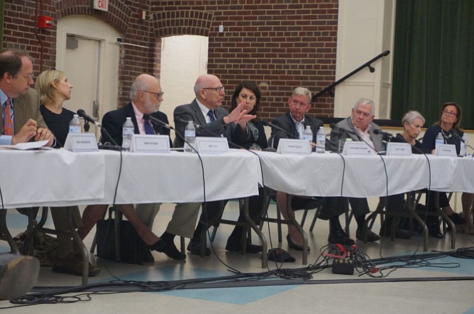 Alexandria businessman Rodger Digilio, fourth from left, expresses his concerns regarding the formation of an Old Town BID as part of a panel presentation to City Council June 6 at the Durant Center.  Digilio was one of eight citizens selected by City Manager Mark Jinks to participate on the panel which included business owners both in support of and in opposition to a BID.
