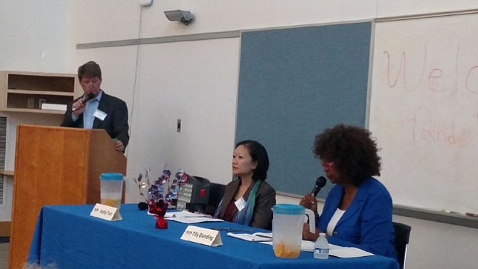 From left: Moderator Mike Henry and Democratic candidates Kathy Tran and Tilly Blanding debate a variety of issues during a forum at the West Springfield Government Center on Wednesday."
