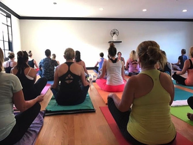 Following the ribbon-cutting ceremony for the new space, Pollard and Layfield held a free Vinyasa yoga class to celebrate the opening of the new studio. 