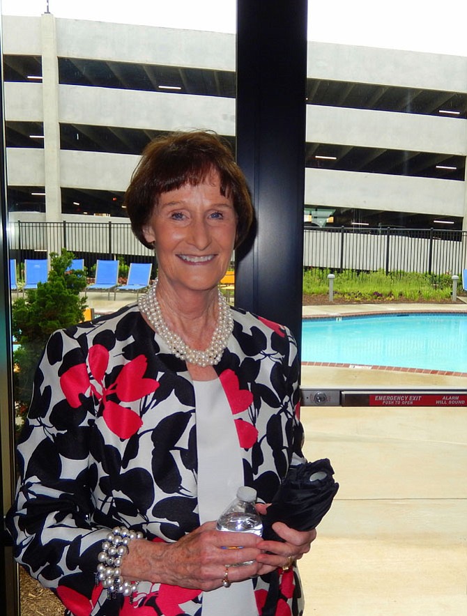 With the pool in the background, Sharon Bulova stands in the building’s club room.
