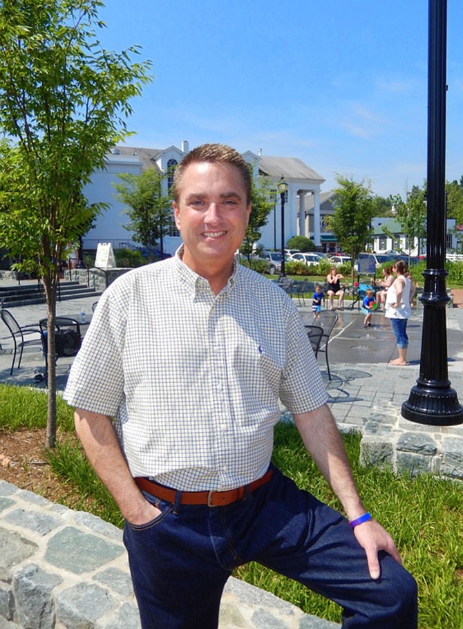 Former Fairfax City Mayor Scott Silverthorne enjoying Old Town Square, which was approved and built during his tenure.