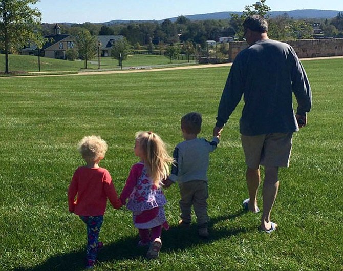 A tender moment between Scott Silverthorne and his great nieces and nephew.