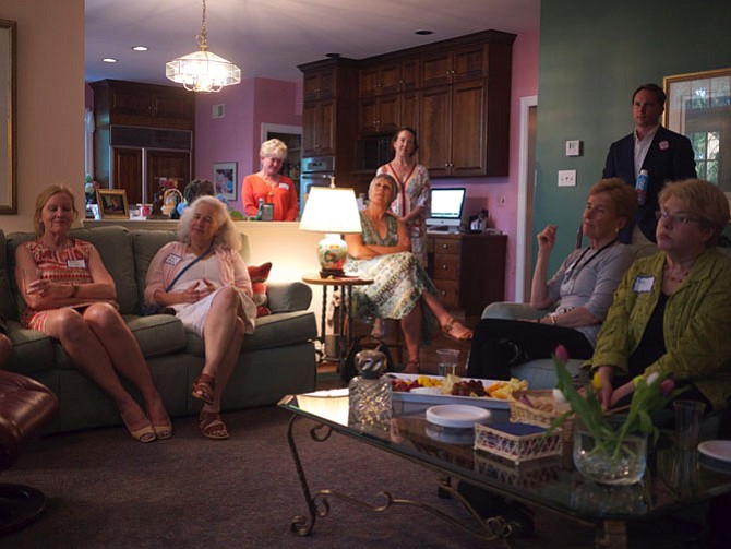 Arlington residents gather in Gail Harrison’s living room to hear Zack Wittkamp, a Democratic candidate in the 94th House District race.