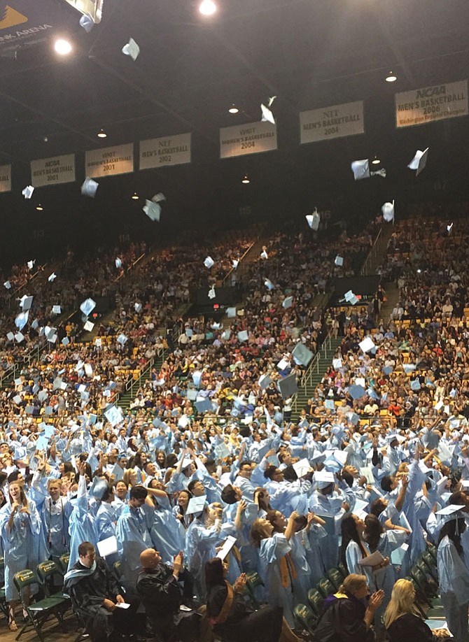 The class of 2017 throws their caps in the air as the ceremony ends.
