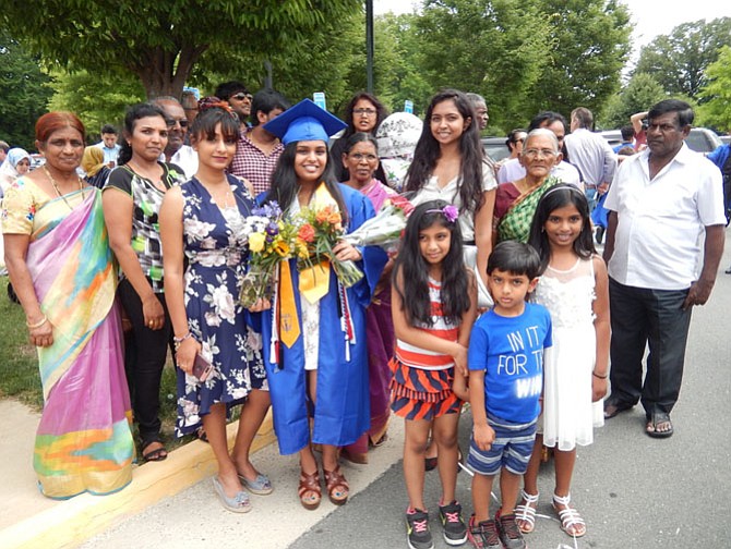 Many family members help Senior Class secretary Geetika Guturu celebrate her graduation.