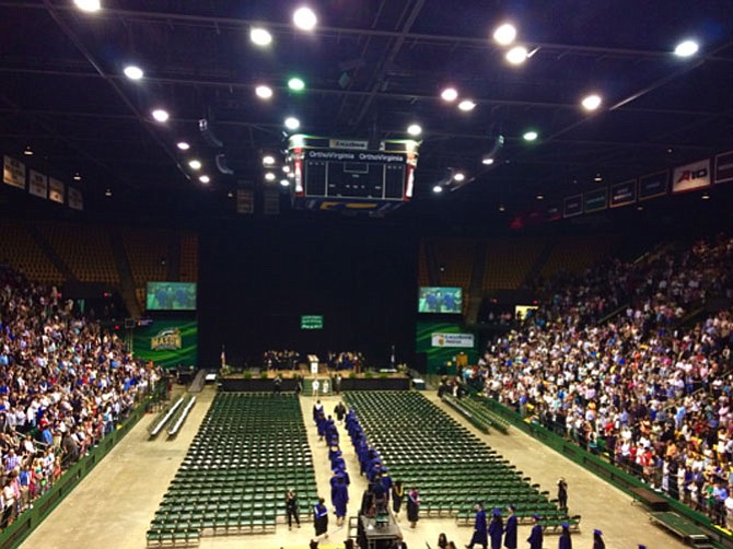 South County High School graduates enter the George Mason University’s Eagle Bank Arena on June 16. 