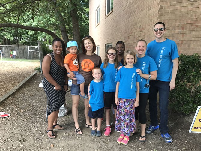 Adults, from left: Meishah Hatfield (Dumfries, Government Contractor), Kathleen Ambroso (Franconia, stay at home mom), Glanatta Kay Carter (Woodbridge, System Analyst), Lilli Mitchell (Burke), Jason Mitchell (Burke, Pastor at First Baptist Church Springfield) and children (from left) JD, Jesse, Ada and Izze join together at Springfield Gardens to pass out meals to children.