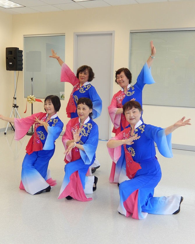 Sully Senior Center dancers entertain during the grand opening ceremony.