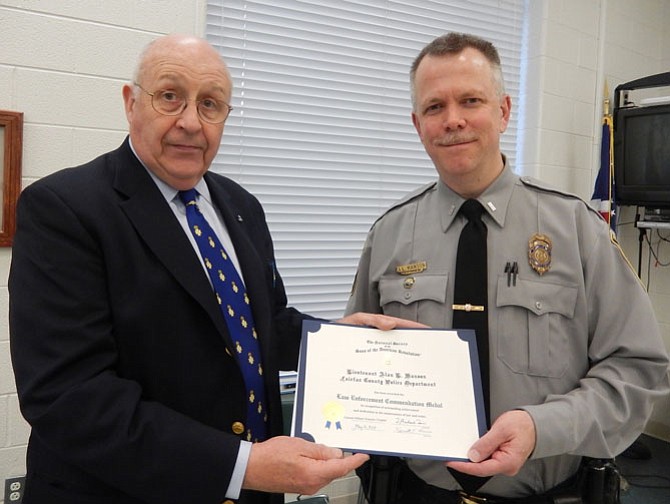 Bill Collier (left) presents the citation to Lt. Alan Hanson.