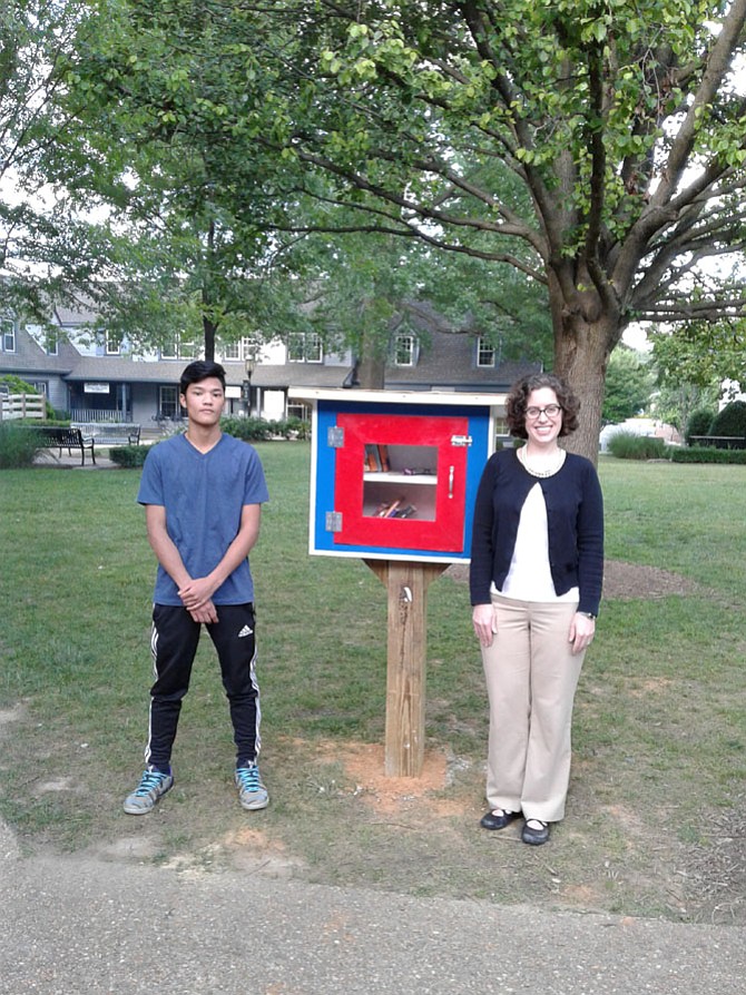 Neal Kelly and Michelle Miller at the Little Library near the Great Falls Creamery.
