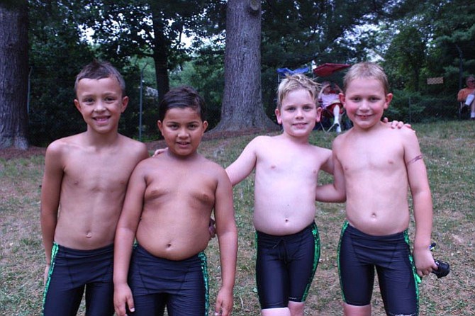 8 & Under Winning Relay: E. O'Connor, A. Bange, C. Thomson, and N. Harris.