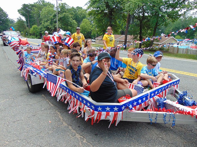 A float filled with children in the Orange Hunt Fourth of July Parade. 