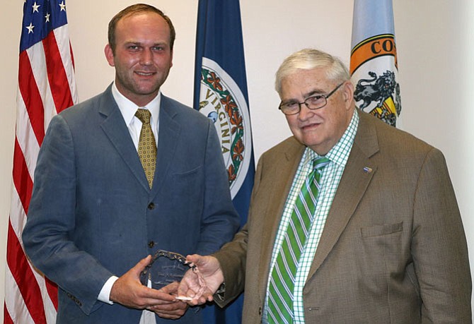 Friends of the McLean Community Center President W. Glenn Yarborough, Jr. (right) presents the award to Paul Kohlenberger.