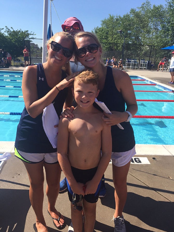 Ethan Wilson was all smiles with SS2 Coaches Katie O'Brien and Caitlin Campbell. In back is Coach Scott Brown.