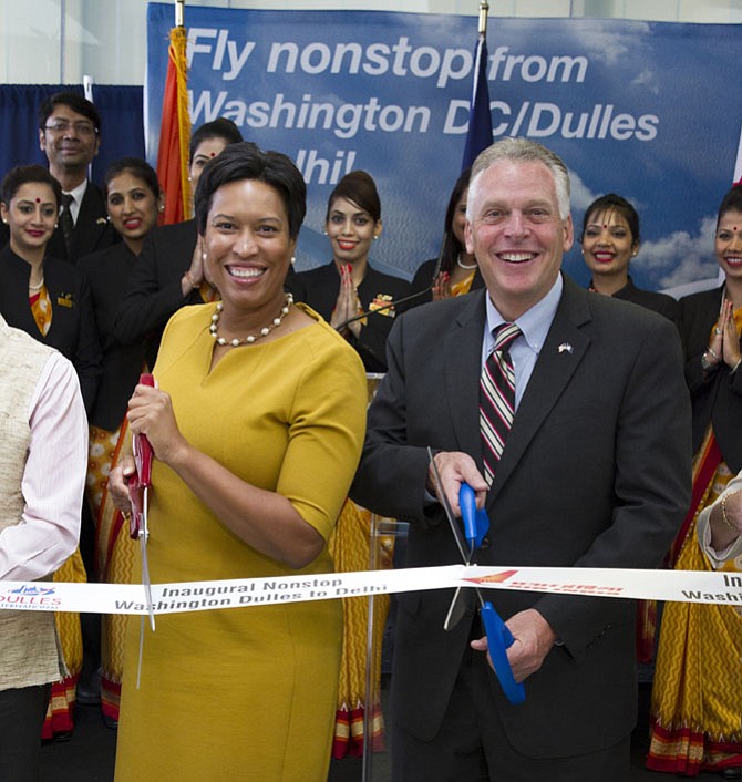 Gov. Terry McAuliffe and District of Columbia Mayor Muriel Bowser took part in a ribbon-cutting ceremony at the end of a press conference celebrating the inaugural nonstop Air India service between Dulles and Delhi on July 7 at Dulles International Airport.  Air India becomes the only carrier offering nonstop service from Washington to India and will operate three times a week. 
