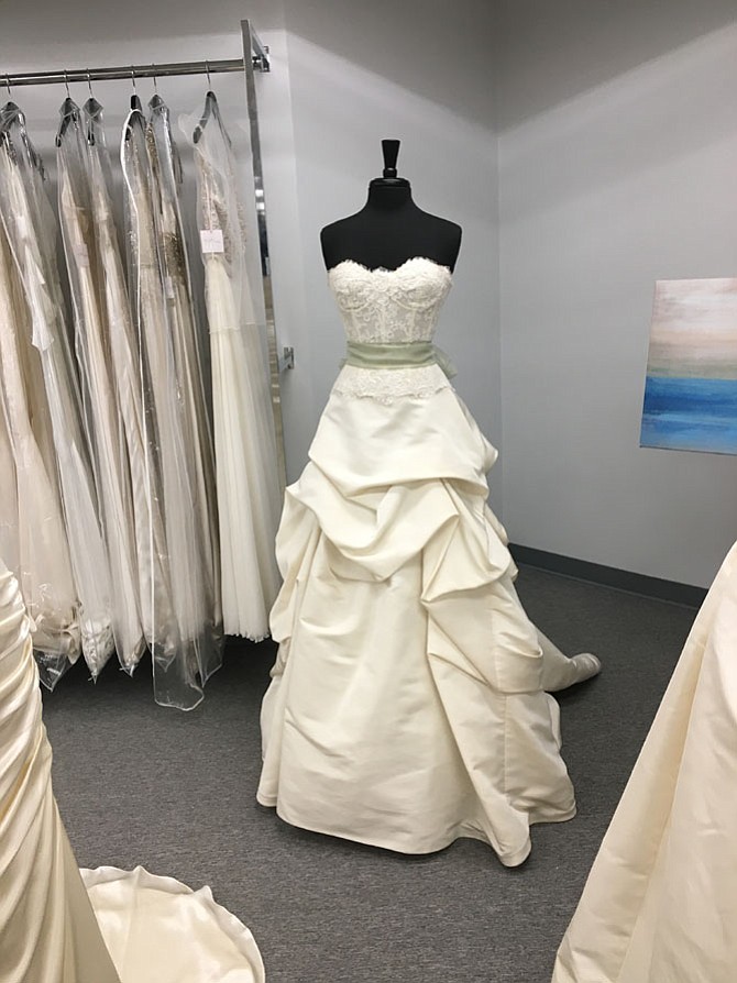 Say Yes for Less opened recently in Cabin John Mall. Owner Pamela Vito sells designer wedding dress samples to allow brides to pay less and still look great on their wedding day.
