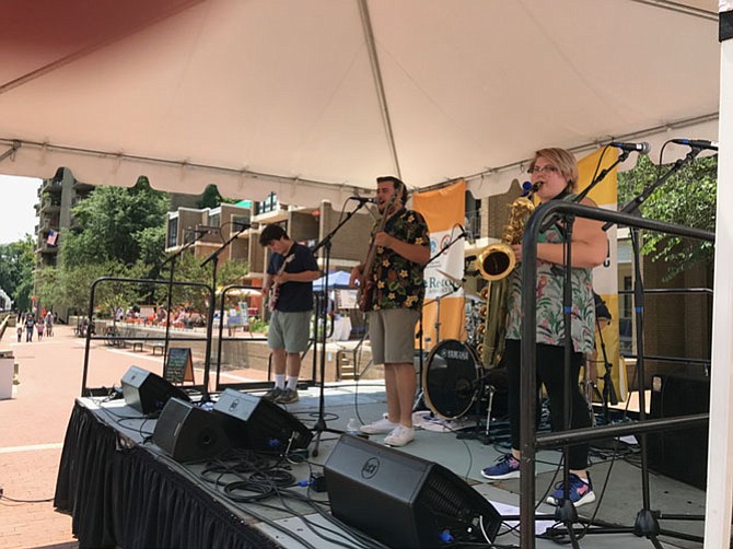 Catchin' Toads is a local classic rock and blues band composed of musicians, from left: Kamron Rose, Zach Schwartz, Julia Rose, and Jeremy Nachison. As the initial performers for the debut of the Lake Anne Roots Music Festival, they held their own and wowed the crowd. The group is known for winning back-to-back band battles.
