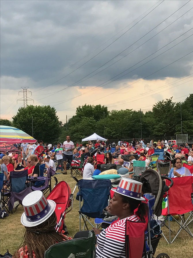 Dark clouds didn't stop 4th of July festivities in the Town of Herndon.  Thousands gathered to enjoy the old-fashioned games, arts and crafts, food, music, vendors  and the fireworks display offered by Herndon Parks and Recreation.  Many families set up their lawn chairs and blankets in Bready Park Softball Field while others favored the grassy slopes and sidewalks near the Herndon Centennial Golf Course.   