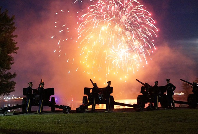 Cannon fire from the Presidential Salute Battery of the 3rd United States Infantry Regiment at Joint Base Myer-Henderson Hall highlights the grand finale fireworks display during Tchaikovsky's “1812 Overture” at the City of Alexandria’s 268th birthday celebration July 8 at Oronoco Bay Park.