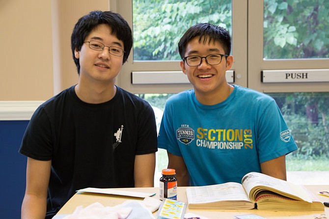 Bradley Kim, 17, and Daniel Tran, 18, of McLean High School are helping out with the week-long camp this summer. They used to play in the orchestra at the Summer Strings Camp when they were kids.