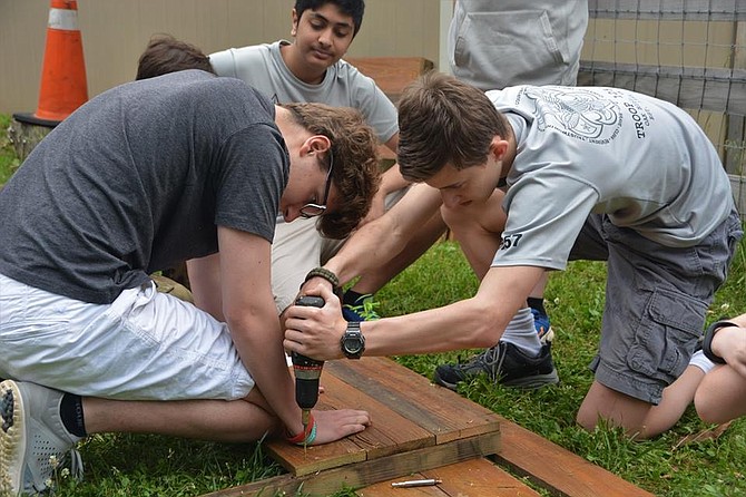 Scouts with the Boy Scouts of America Troop 1257 of Oakton helped Alexander Yusman, 13, of Herndon finish his service project — planting herb gardens — at the Fairfax County Animal Shelter on Sunday, May 21.