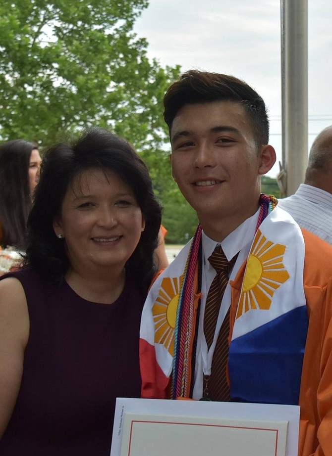 Nicolas Villar, shown with his mother Marlena Villar at his graduation from Hayfield Secondary School, was presented the Peter Williams Memorial Scholarship at the June 28 meeting of Old Town Alexandria Connections at Belle Haven Country Club.