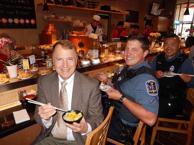 From left: Mayor David Meyer and City of Fairfax Police Officers Wade Brabble and Dale Yung enjoy lunch at KAI 10 Conveyor Sushi.