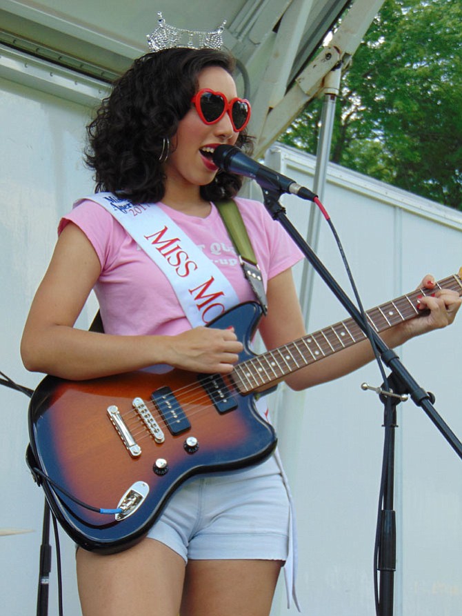 Caroline Weinroth, the lead singer of the Cinema Hearts Band, plays at the first Battle of the Bands at Lakeside Park/Royal Lake in Fairfax on Sunday, July 16.