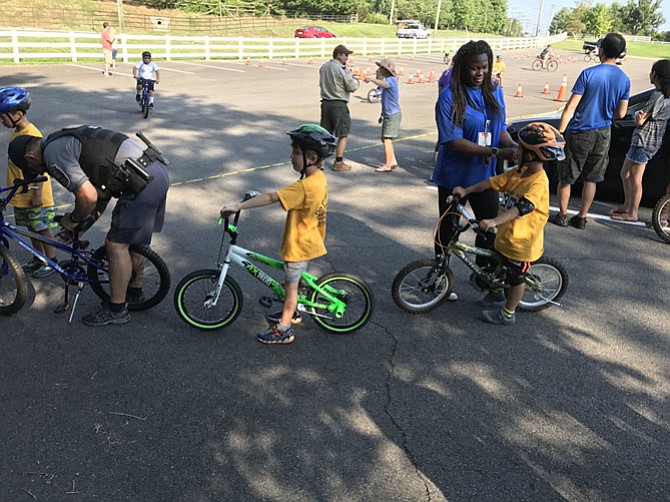 Safety checks include that helmets properly fit.