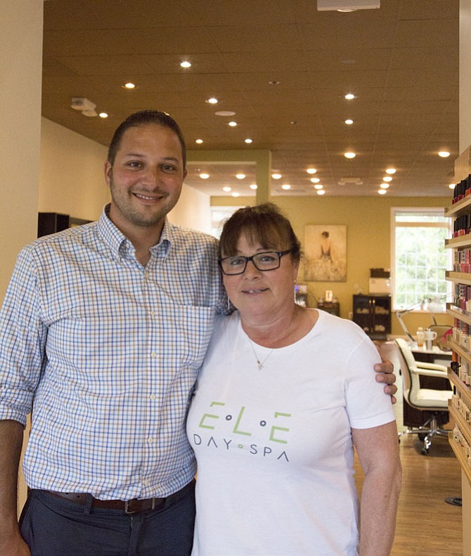 Cosmetologist Lutfiye “Lucy” Yilmaz and her son Erkan Hayiroglu embrace mid-way through their new salon’s grand opening day on Saturday, July 15.