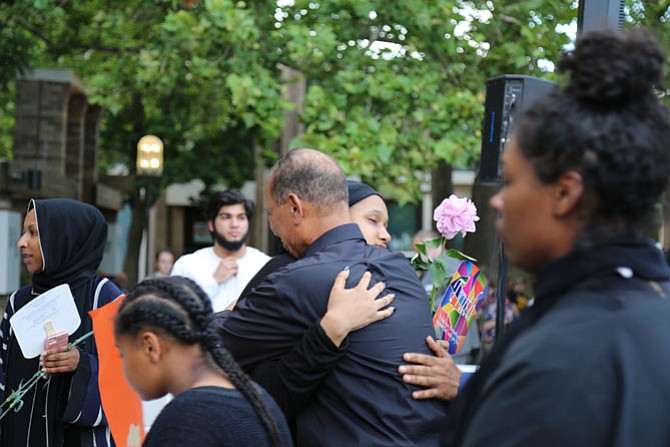 Shahed Mohamed, 15, of Reston, Nabra’s close friend, embraced Mohmoud Hassanen, Nabra’s father, when he arrived at the plaza for the vigil.